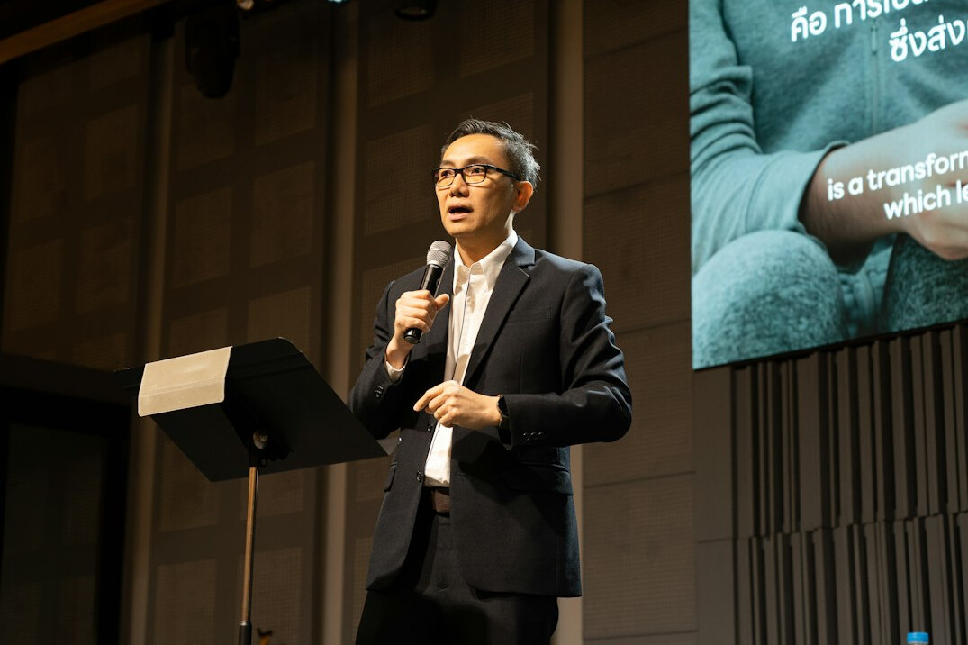 person giving speech on stage