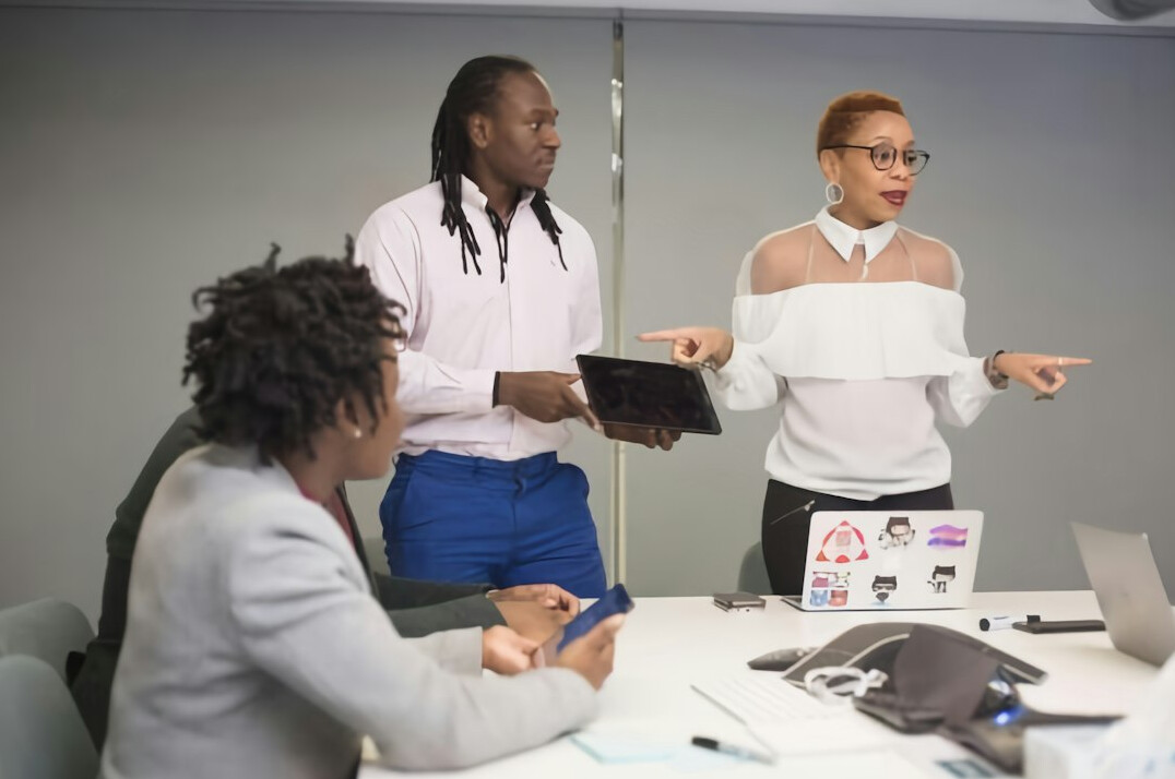 woman presenting to colleagues